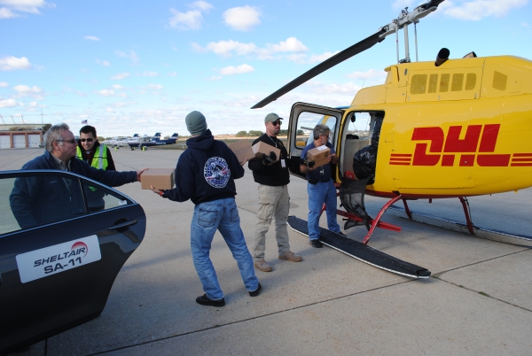 At McArthur Airport in Islip, NY, loading the DHL Helicopter for Staten Island. Photo: Full Throttle Magazine New York At McArthur Airport in Islip, NY, loading the DHL Helicopter for Staten Island. (Photo credit: Full Throttle Magazine New York)