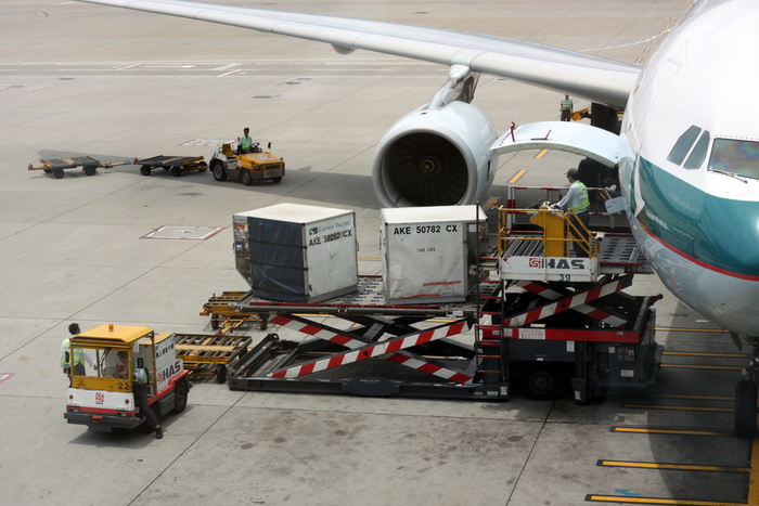 Cathay Pacific loads cargo into a passenger plane deployed to supplement freighter capacity. But falling rates and higher operating costs of the passenger-freighters is causing airlines to review the deployment of the aircraft. Photo credit: Shutterstock