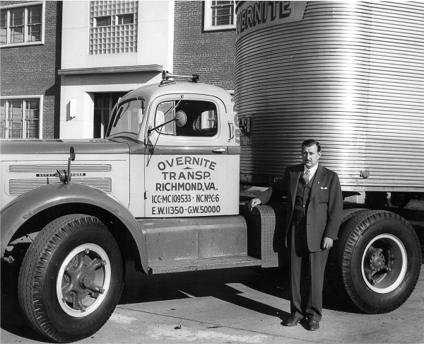 J. Harwood Cochrane and an Overnite White tractor.