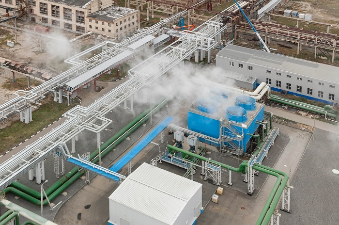US chemical producers knew a sector boom would create logistics challenges. But what they did not anticipate was other growing sectors putting extreme pressure on US trucking, as well, with a huge spillover to intermodal rail. Photo credit: Shutterstock.com. A chemical plant.