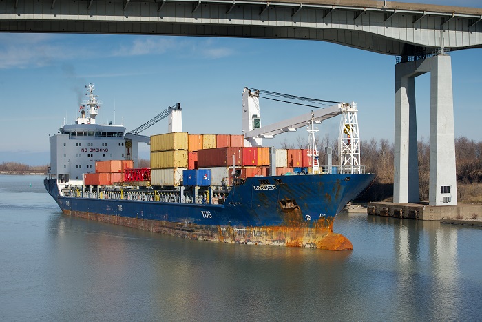 The dispute, which has arisen annually during the past several years, comes as shippers, carriers, and ports prepare for the 2018 Great Lakes/St. Lawrence Seaway shipping season, which runs from late March through year's end. Photo credit: Shutterstock. A container ship.