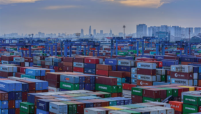 Annual service contract negotiations between US importers from Asia and ocean carriers are moving slower than in past cycles. Beneficial cargo owners (BCOs) are holding out for lower rates, to offset rising supply chain costs elsewhere, but they may be disappointed by their effors. Photo credit: Shutterstock.com. Containers stacked at a port.