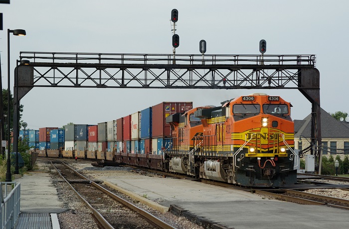 US beneficial cargo owners (BCOs) will face unprecedented challenges using intermodal this peak season. Still, there are time-tested tactics that will ensure the best, possible transportation result. (Above: A BNSF intermodal freight train travels in Illinois, United States.) Photo credit: Shutterstock.com. A BNSF intermodal freight train in Illinois, United States.