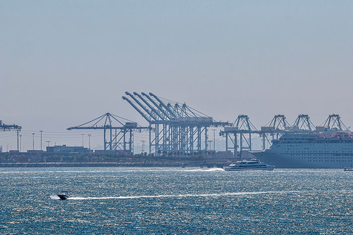 Future emissions reduction efforts at the Los Angeles-Long Beach port complex will focus on the deployment of zero-emission cargo-handling equipment such as forklifts, yard tractors, top-handlers, and rubber-tired gantry cranes (RTGs), as well as emissions-control technologies for vessels and harbor craft. Photo credit: KK Stock / Shutterstock.com.