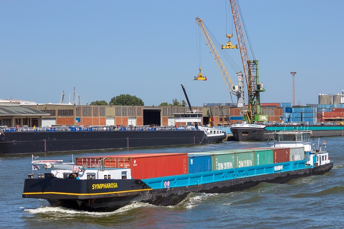 Antwerp wants the barge congestion afflicting the port to be resolved soon and has put in place measures to address the long-running issue.(Above: A barge travels at the Port of Antwerp.) Photo credit: Shutterstok.com. A barge at the Port of Antwerp.