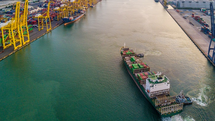 A container ship approaches a port. (Photo credit: Shutterstock.) A container ship approaches a port.