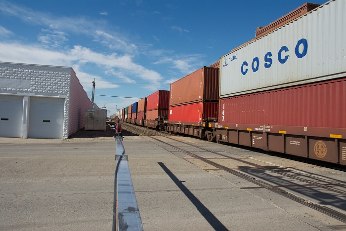 Along with organic growth from a stronger US economy, railroads have also experienced spillover volume from a capacity-tight US trucking market. Photo credit: Shutterstock.com. A freight train in Kansas.