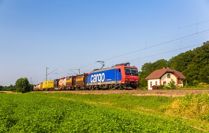 Europe’s rail and truck transport systems are at a pivotal moment. The two could complement each other and help meet the likely 30 percent incease in Europe cargo expected by 2030. However, turf protecting could still rule the day, especially if rail views truck platooning as a threat. (Above: A Swiss Federal Railways freight train travels in Germany.) Photo credit: Shutterstock.com. Swiss Federal Railways.