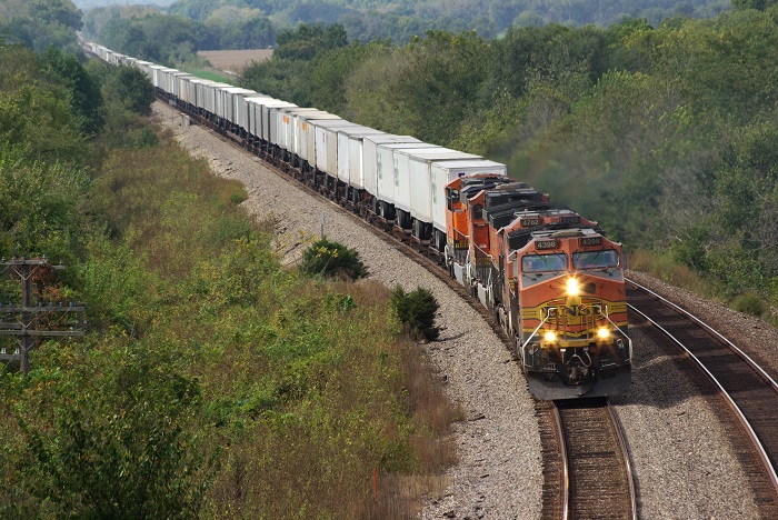 Rising intermodal spot rates and tight capacity on the rails are making it difficult for latecomers seeking to shift freight off highway. (Above: A train travels in Ilinois.) Photo credit: Shutterstock.com. A freight train travels in Illinois, United States.