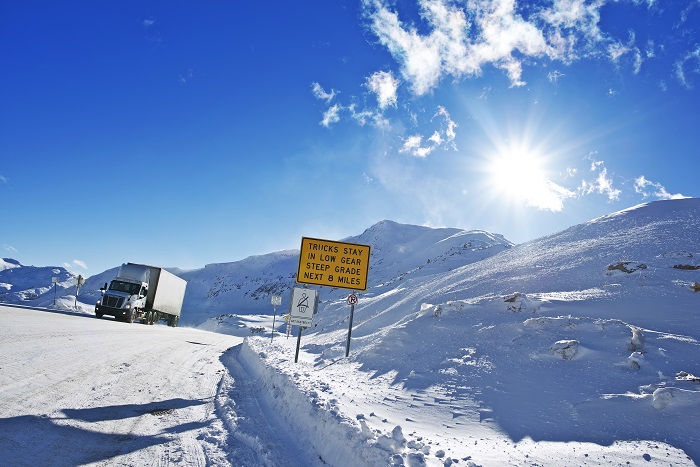A truck travels on a US road.