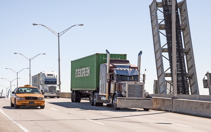 An early peak could snap up US truck capacity and bring more pressure to pricing. Photo credit: Shutterstock.com. Trucks travel in Florida.