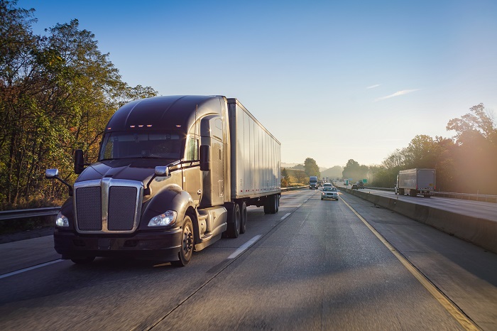 US shippers turning to LTL to move their freight are paying high spot rates, as the carriers balance these short-term shippers with their core long-term customers' needs. Photo credit: Shutterstock.com. A truck travels on a US highway.