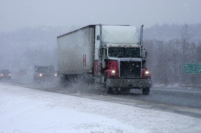 Demand for US trucking services is increasing in early 2018, even as the ELD has, at least temporarily, led to a dip in truck capacity. Photo credit: Shutterstock. A truck on a US highway.