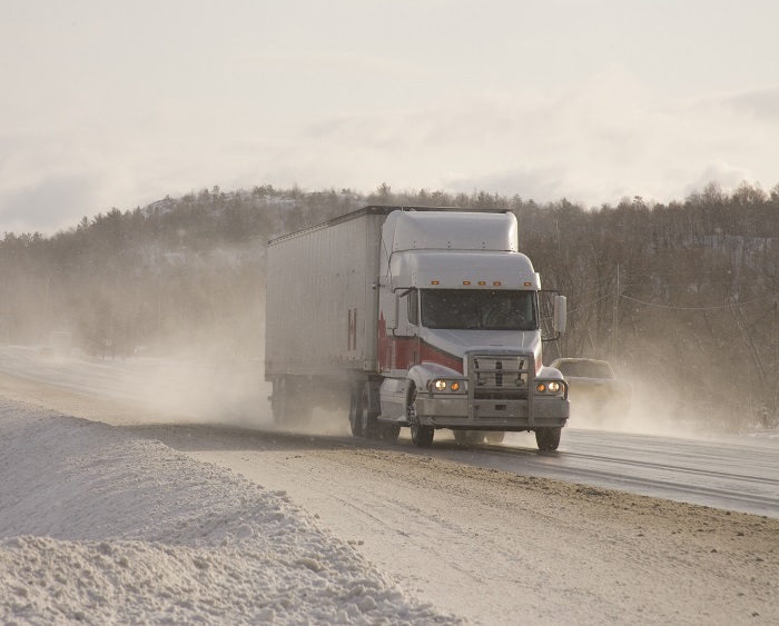 A truck travels on a US secondary road. Photo credit: Shutterstock.com A truck travels on a US secondary road.