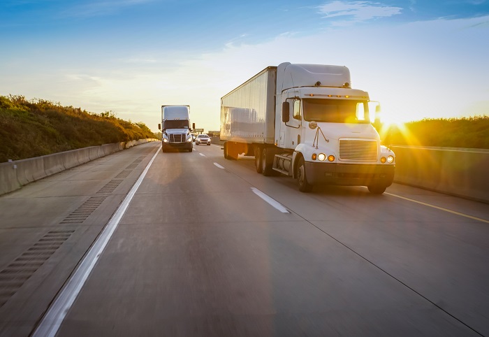 The electronic logging device (ELD) mandate did not cause a loss of drivers, but a loss of driving hours. Further, changes shippers made that were propelled by the ELD are likely to be lasting, even if exemption amendments for selected trucking segments are passed. Photo credit: Shutterstock.com. Trucks travel on a US highway.