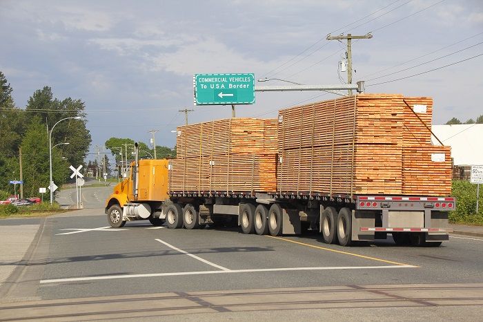 Brokers and shippers would have the first official checklist to follow when hiring truckers if an amendment to the Federal Aviation Administration Act reauthorization passes this year. Photo credit: Shutterstock.com. A truck travels on a US road.