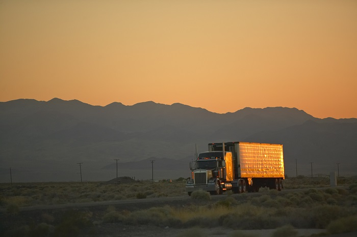 It’s true that the hours-of-service regulations did not change. Not enough minutes is a byproduct of the digitization of time. Paper logs are out, electronics are in. Photo credit: Shutterstock.com. A truck travels on a US road.