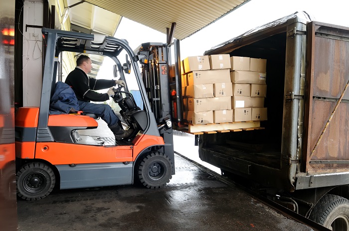A truck being loaded in the United States.
