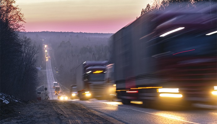 For years, North American shippers were warned a truck capacity crunch was coming, but that crunch never materialized. This year, with the accelerating US economy, that crunch finally arrived. Photo credit: Shutterstock. Trucks travel on a road.