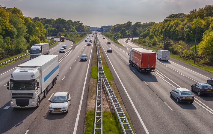 Above-trend GDP growth is boosting commerce, and that’s triggered a steady uptrend in trucking rates, amid tigher capacity — a trend shippers should expect through 2018. Rail is benefiting from some spillover transportation work, but the conversion is not nearly large enough to reduce rates. (Above: Trucks travel on a highway in the Netherlands.) Photo credit: Shutterstock.com. Trucks travel in the Netherlands.