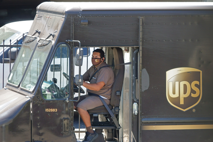 UPS package cars are making 15 more stops a day on average, and density in the delivery network is lighter, raising operating costs, the company said. Photo credit: Shutterstock.com.
