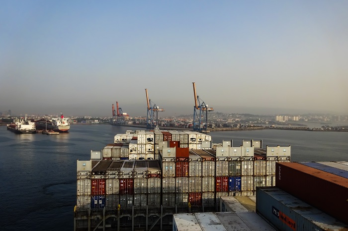 Transshipment traffic is the cargo that is transported between an Indian port and an international “hub” port, when direct mainline connections are not available. (Above: Visakhapatnam Port, India.) Photo credit: Shutterstock.com. Visakhapatnam Port, India.