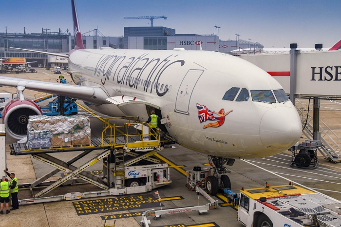 The two main regional markets for air freight – Asia-Pacific for international shipments and North America for domestic shipment — may be headed toward slower growth, due to the ongoing trade war between their two largest economies, Airport Council International said. (Above: Air cargo being loaded at London's Heathrow Airport.) Photo credit: Shutterstock.com. Air cargo being loaded at London's Heathrow Airport.