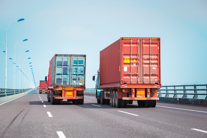 Trucks travel on a highway in China.