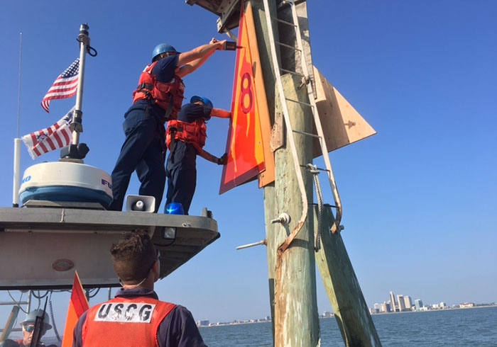 Coast Guard Aids to Navigation team crewmembers replace and repair navigational aids in the Port of Corpus Christi, Thursday.