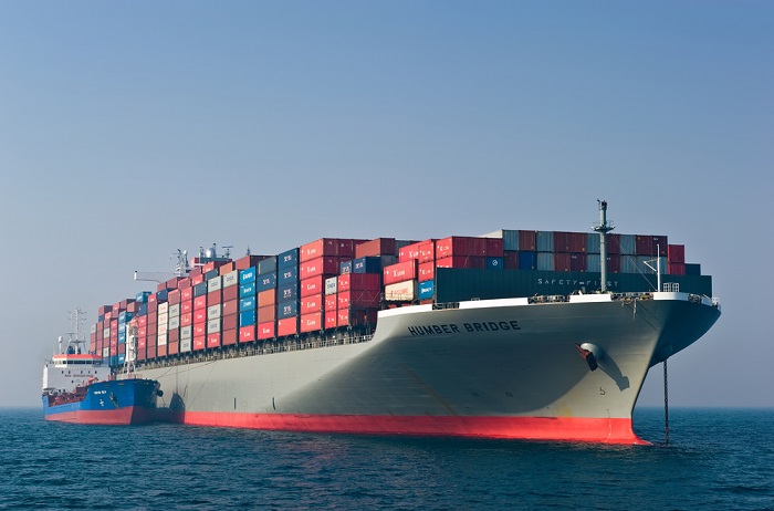 Industry analysts expect the vast majority – all but 5 percent or 10 percent – of ships to use low-sulfur fuel to meet the IMO’s requirements. Photo credit: Shutterstock.com. A container ship bunkering / receiving fuel.
