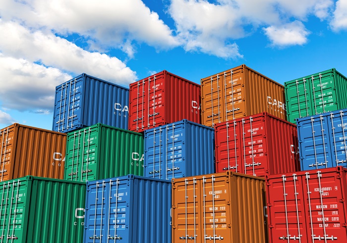 On Tuesday evening, owners of trucks and lorries called-off their strike after a meeting with government officials. Photo credit: Shutterstock.com. Containers stacked at a port.