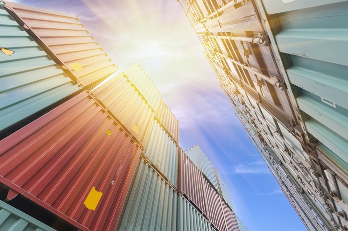 Most Benapole imports are capital machinery for industrial units, apparel factories, and infrastructure projects – the handling of which requires cranes and forklifts. Photo credit: Shutterstock.com. Containers stacked at a port.