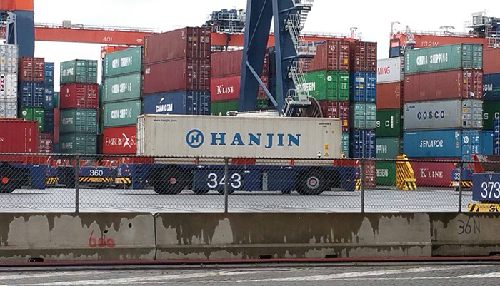 Getting stranded Hanjin Shipping containers out of ECT in Rotterdam, such as this one pictured on an automated vehicle, just got a whole lot cheaper for shippers.