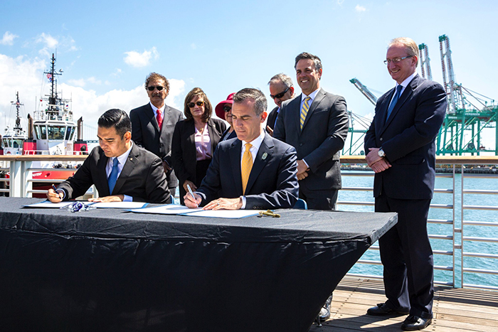 Long Beach mayor Robert Garcia, left, and Los Angeles mayor Eric Garcetti reaffirm their commitment to making port operations more environmentally sustainable.