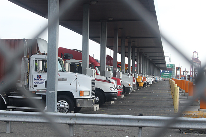 Trucks enter the gates of Maher Terminals in the Port of New York and New Jersey.