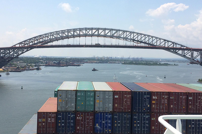 The OOCL Berlin prepares to pass under the recently raised Berlin Bridge.