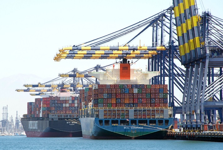 Word came late Saturday that China President Xi and President Trump at the G20 summit had agreed to a 90-day truce in which the US would not impose higher tariffs on Jan. 1 as threatened. In exchange, the Trump administration said China has agreed to import a "very substantial" amount of US agriculture products and other goods, to decrease the trade imbalance between the two countries. (Above: The Port of Los Angeles.) Photo credit: Shutterstock.com. Two ships at the Port of Los Angeles.