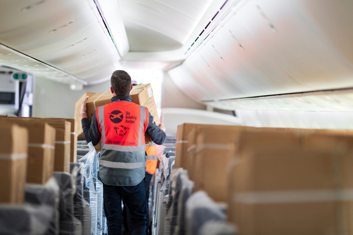 Passenger planes carrying only cargo are providing urgently needed capacity, but the loading and unloading process is inefficient and heavily dependent on manpower. Photo credit: Shutterstock