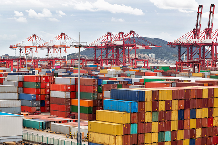 Container volume growth tends to outpace the expansion of the value of trade by 1 to 2 percentage points, but both are flattening. Photo credit: Shutterstock.com