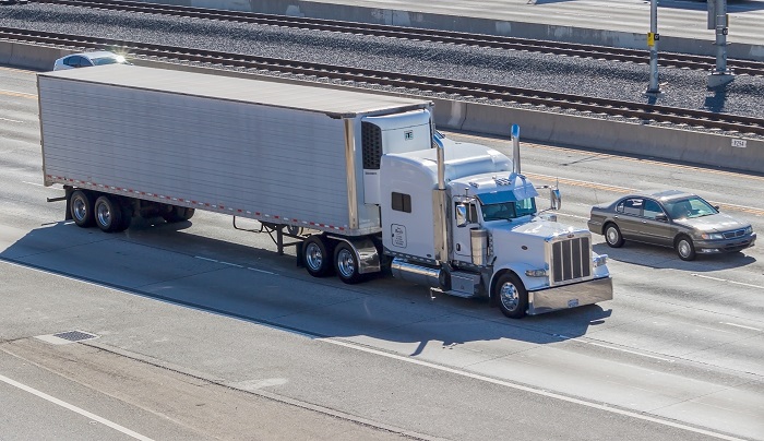 Two major developments have produced unusually strong price increases in both international and domestic freight movement this year, analysst on Tuesday told more than 370 attendees of the JOC Inland Distribution Conference. Photo credit: Shutterstock.com. A truck travels in California, United States.