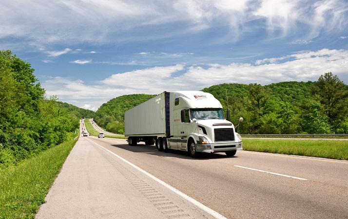 US carriers are ordering trucks at record high numbers, but those trucks won’t be built, let alone hit the road, until next year. Drivers will still be hard to hire. Photo credit: Shutterstock.com. A truck travels on a US highway.