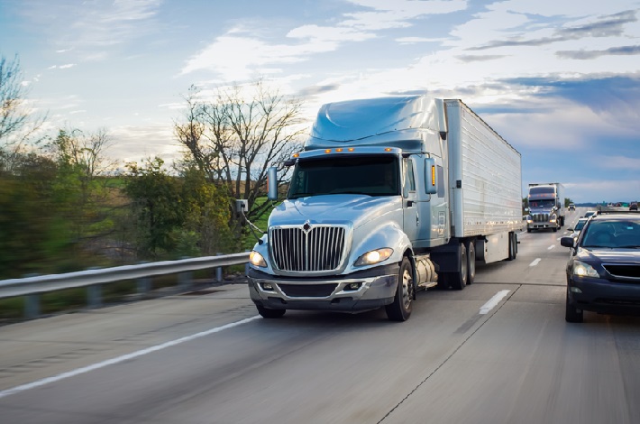 A truck travels on a US highway.