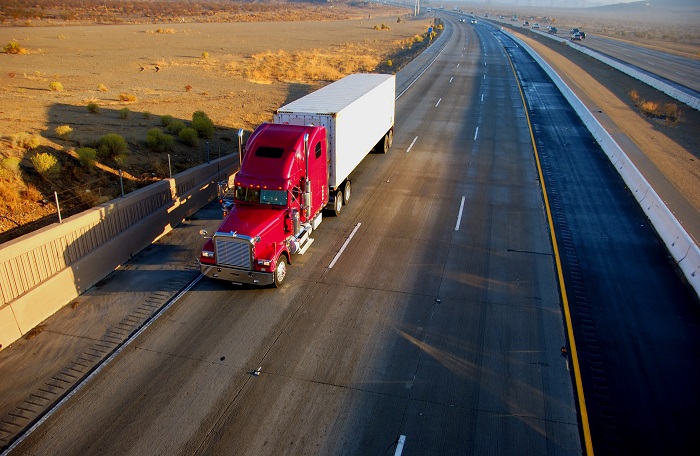 As the fourth quarter begins and the US trucking peak looms ahead, many shippers are launching bids that will take effect in the first or second quarter of 2019, setting price and service expectations for the year. Photo credit: Shutterstock.com. A truck travels on a highway in the United States.