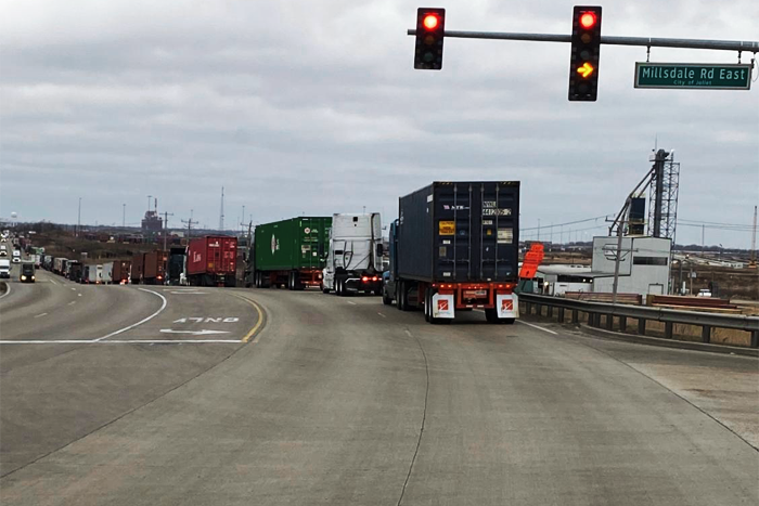 Trucks lined up for several miles on Dec. 30 outside Union Pacific's Global IV terminal with data showing turn times well above normal. Photo credit: Dominic Pacella/Cushing Transportation