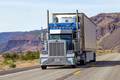 Freight surged on the spot market through November in what proved to be a delayed “peak” season for pre-holiday freight moved by truck and intermodal rail. The delay is attributed to a substantial “pull forward” of retail freight in June and July ahead of US tariffs on Chinese goods. Photo credit: Shutterstock.com. A truck travels in the United States.