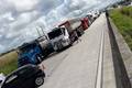 Over the weekend, drivers protested at Alemoa, in front of the main road access to the port of Santos, and closed the main highway between São Paulo and Rio de Janeiro for six hours, backing up truck traffic more than two kilometers (1.24 miles). (Above: A Brazilian truckers protest earlier in 2018.) Photo credit: Rob Ward. Brazil truckers on strike - May 2018.