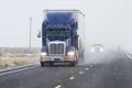On the US landside, an effort to 'beat the March 1 deadline,' would create more demand for container drayage, over-the-road trucking, and intermodal rail in the first months of 2019. Photo credit: Shutterstock.com. A truck travels on a US road.