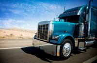 A truck travels on a US highway.