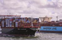 Maersk and MSC vessels pass each other outside the Port of Rotterdam.