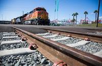 A train travels near the the Port of Long Beach.